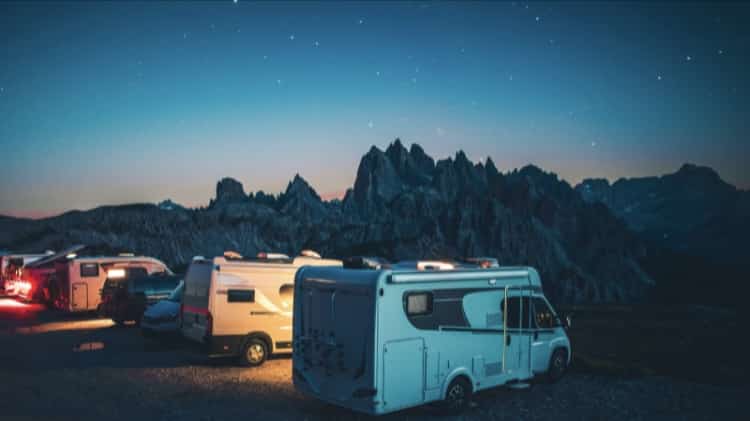 an rv van on a mountain cliff