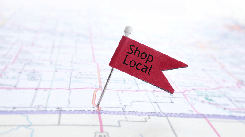 a large sign that says Shop local