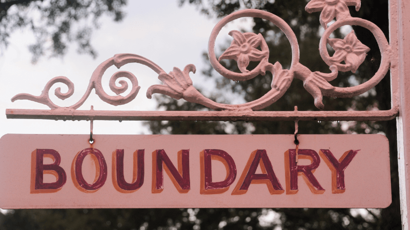 The word boundary painted on a front house door