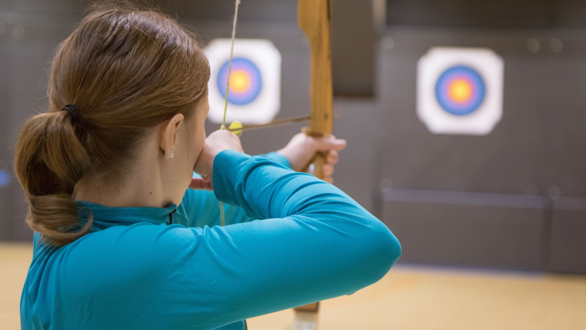 A woman shooting an arrow