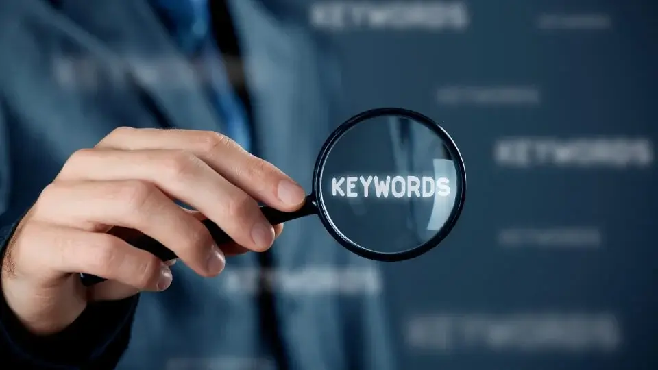 close up of the word keywords under a magnifying glass