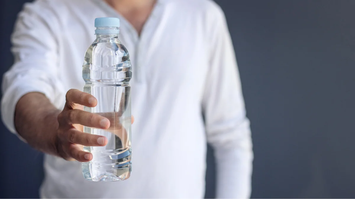 A student holding a bottle of water