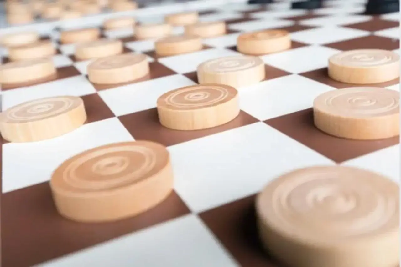 A checkerboard set on top of a living room table