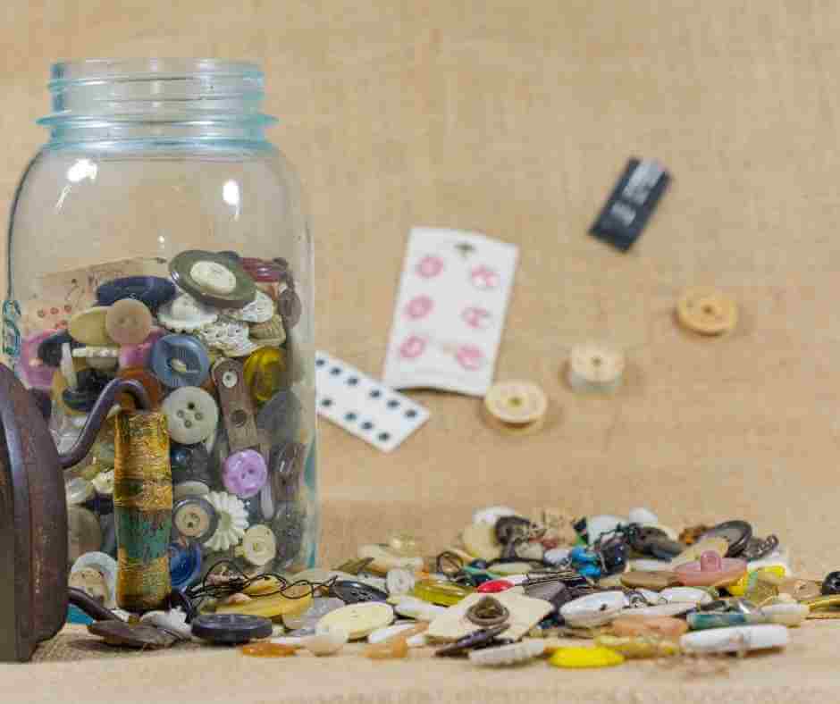A mason jar filled with buttons