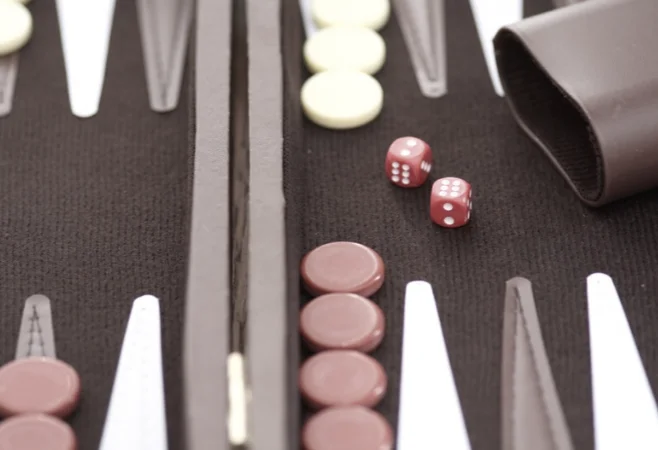 An opened backgammon game set on a table