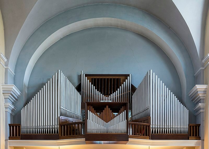 Pipe organs on a stage in a cathedral