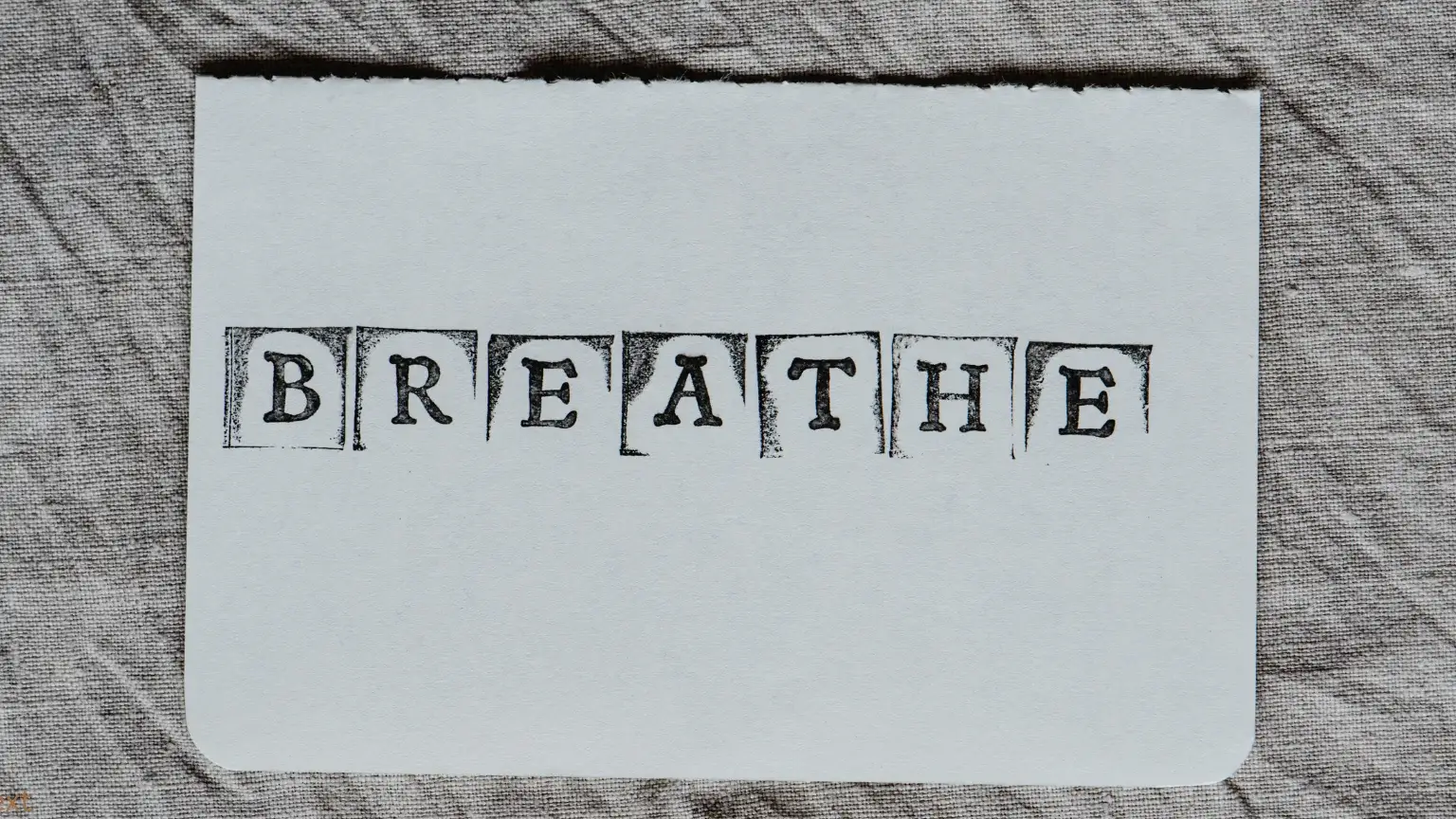 A sign that says breathe