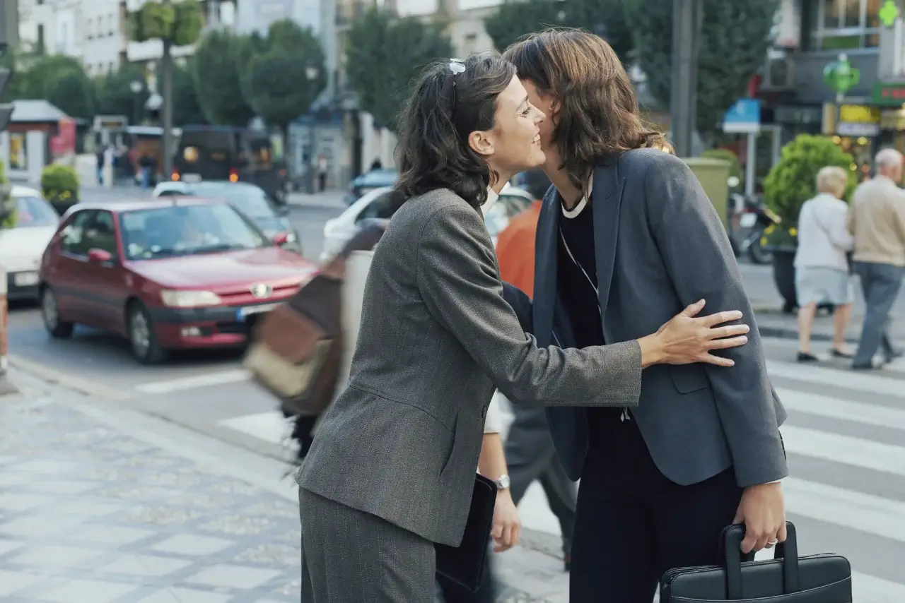 Two French business women kissed seeing each other on the cheek