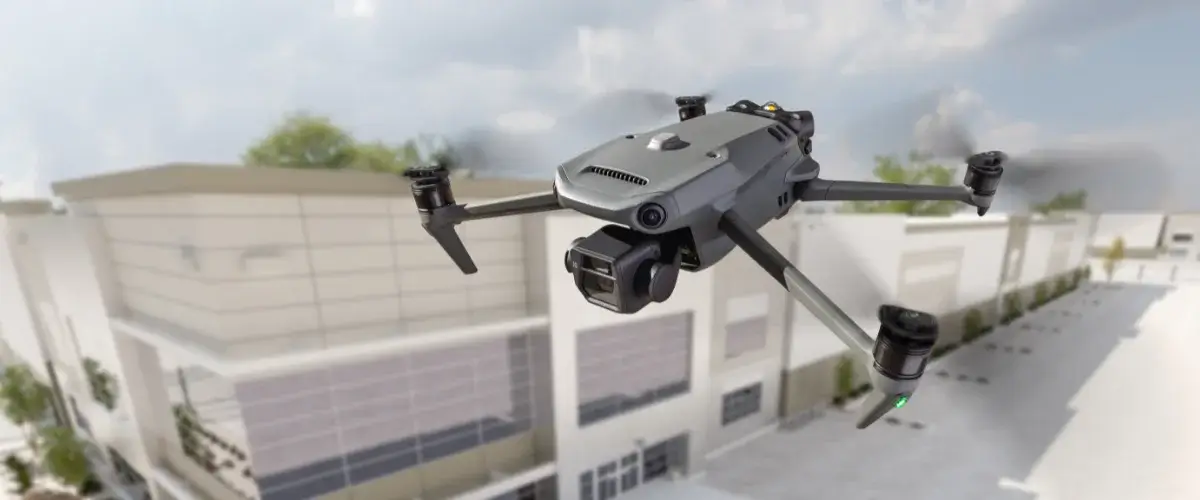 A drone patrolling over a crowded stadium with real-time monitoring equipment.