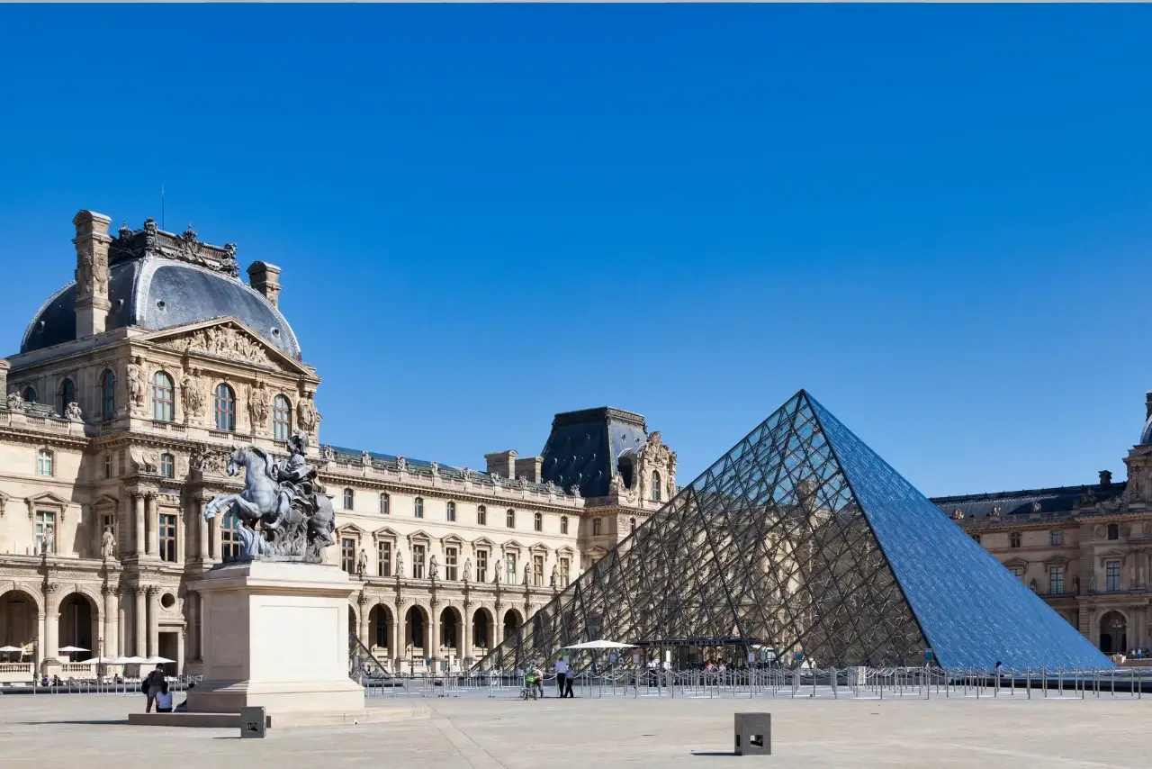 A person admiring a painting at a museum