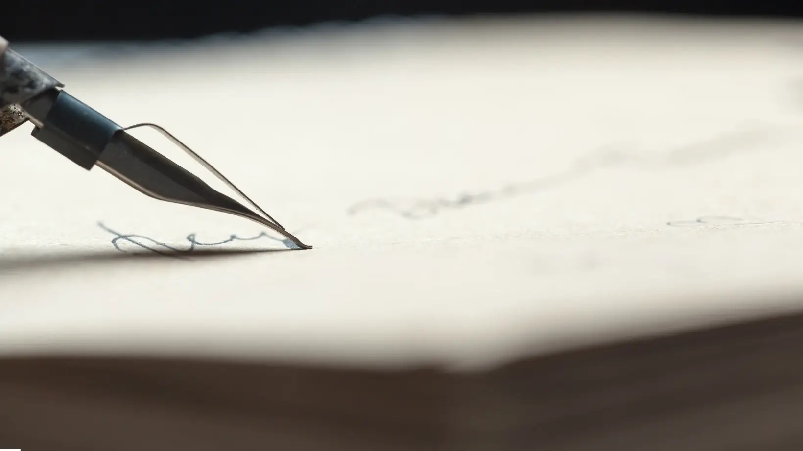 A stack of writing journals on a desk