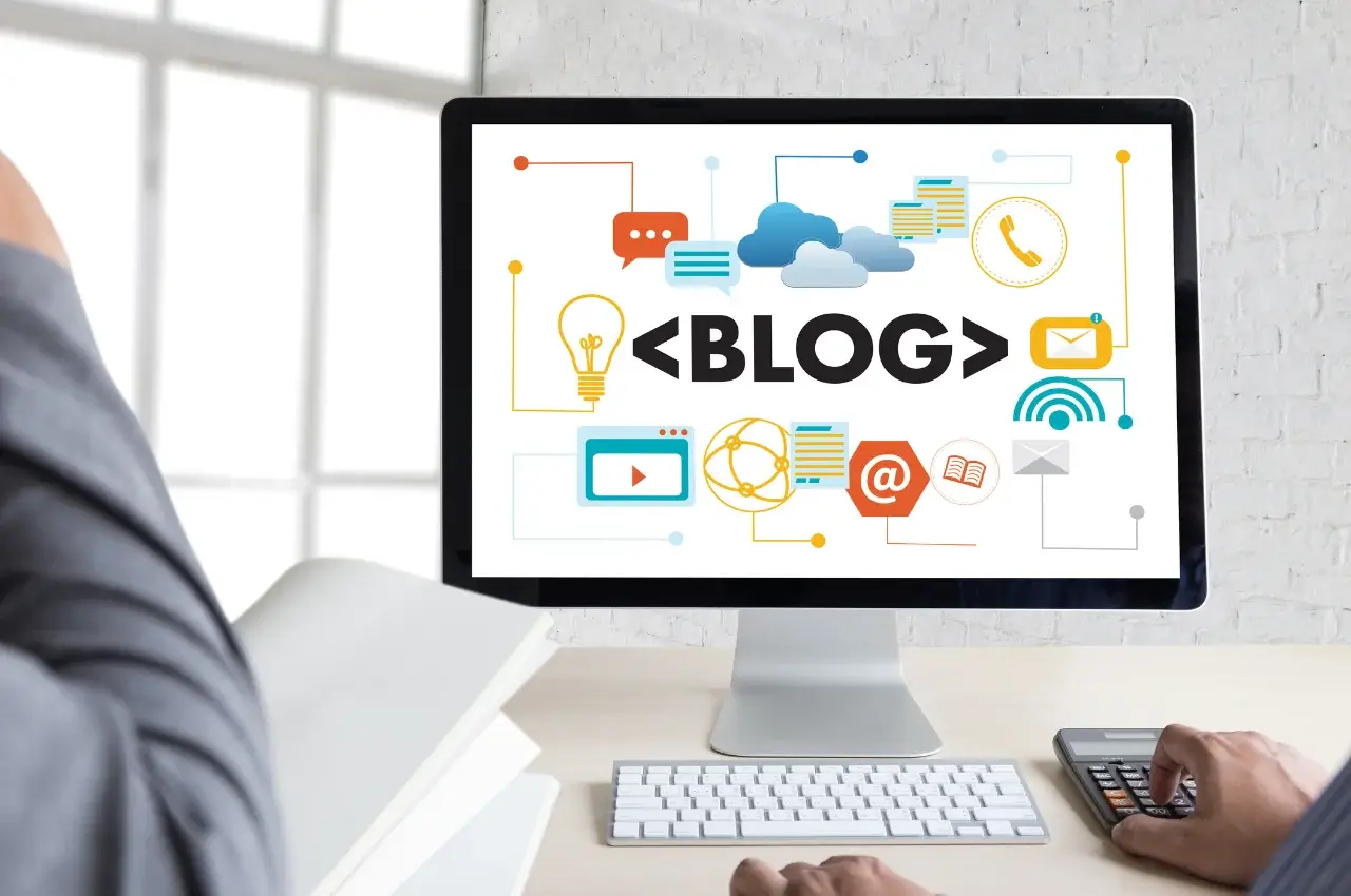 Beginner creating a blog website on a laptop