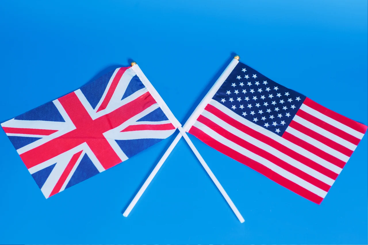 American flag and British flag side by side for a comparison of English differences