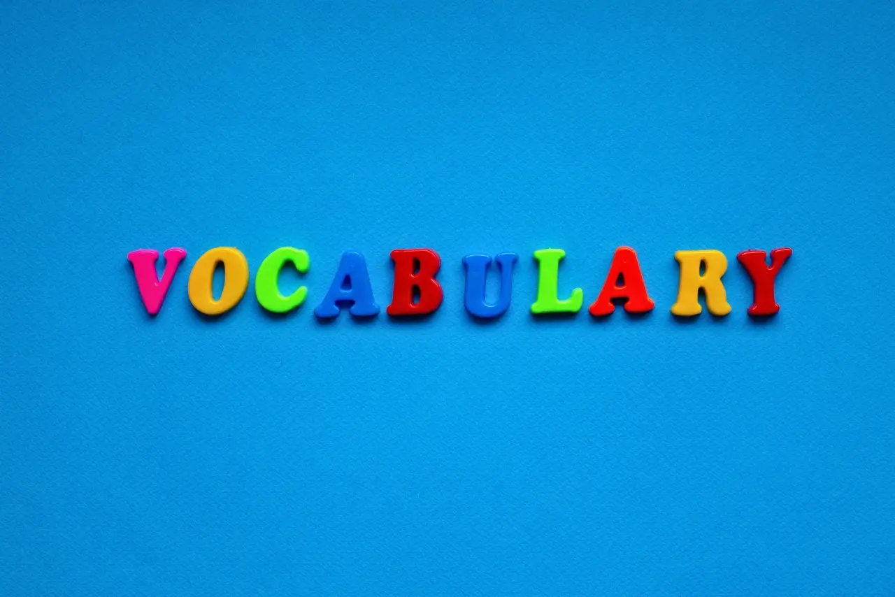 Person studying vocabulary words to improve writing and communication skills