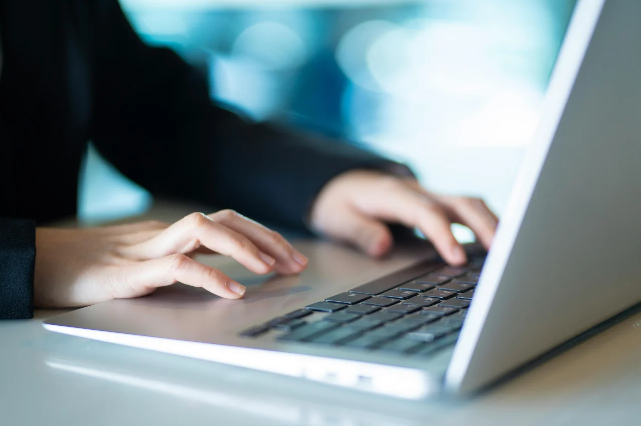 Blogger reviewing website analytics and monetization strategies on a laptop