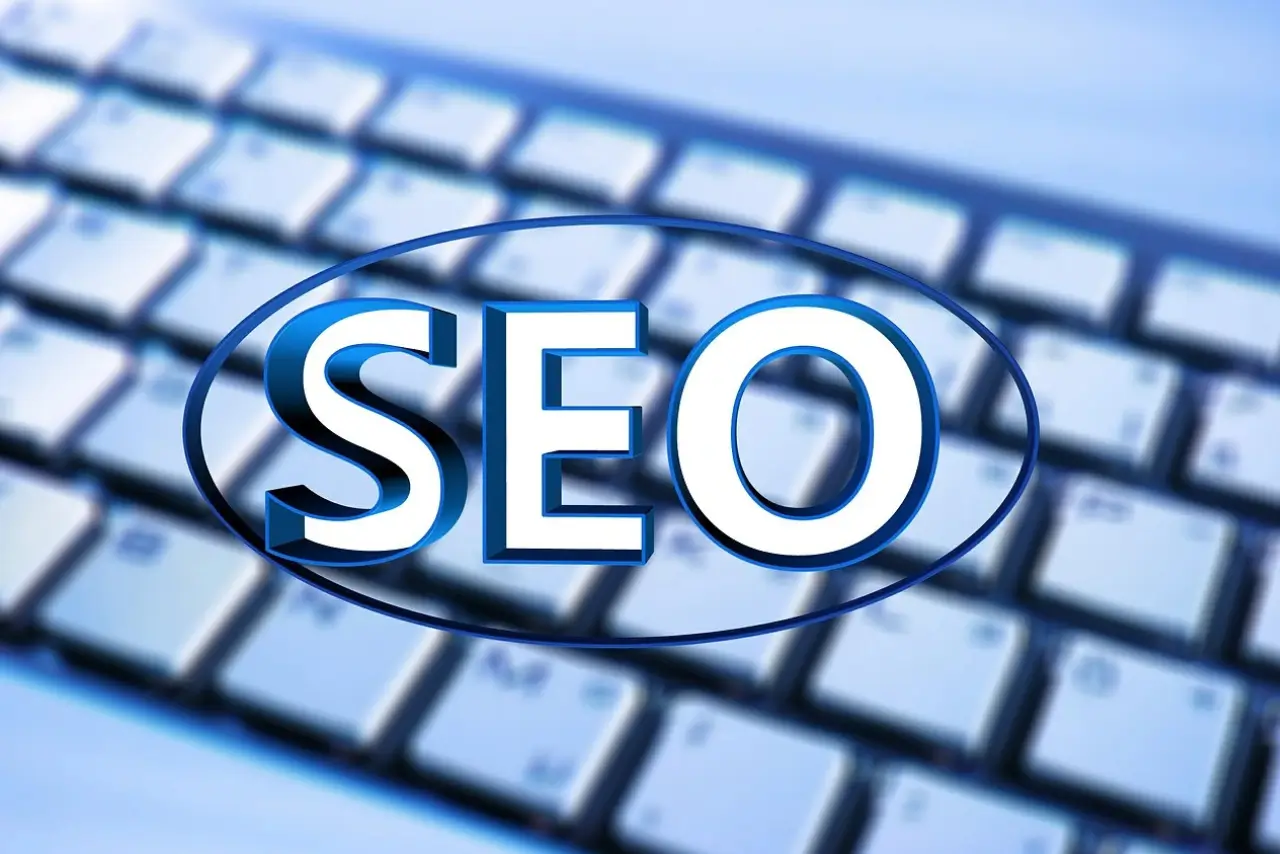 Laptop with SEO analytics dashboard + traffic growth chart